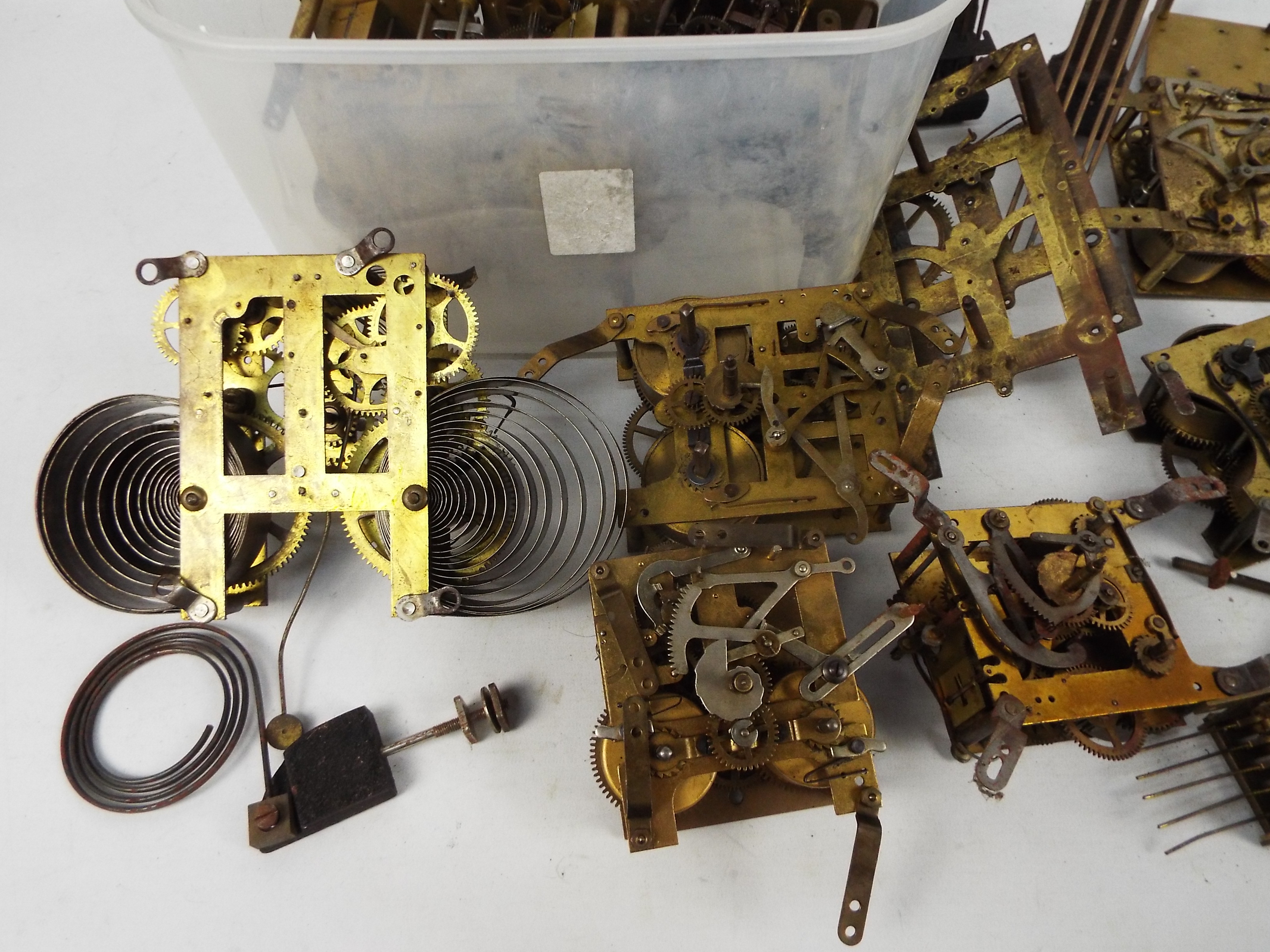 A collection of various clock movements and parts. - Image 2 of 5