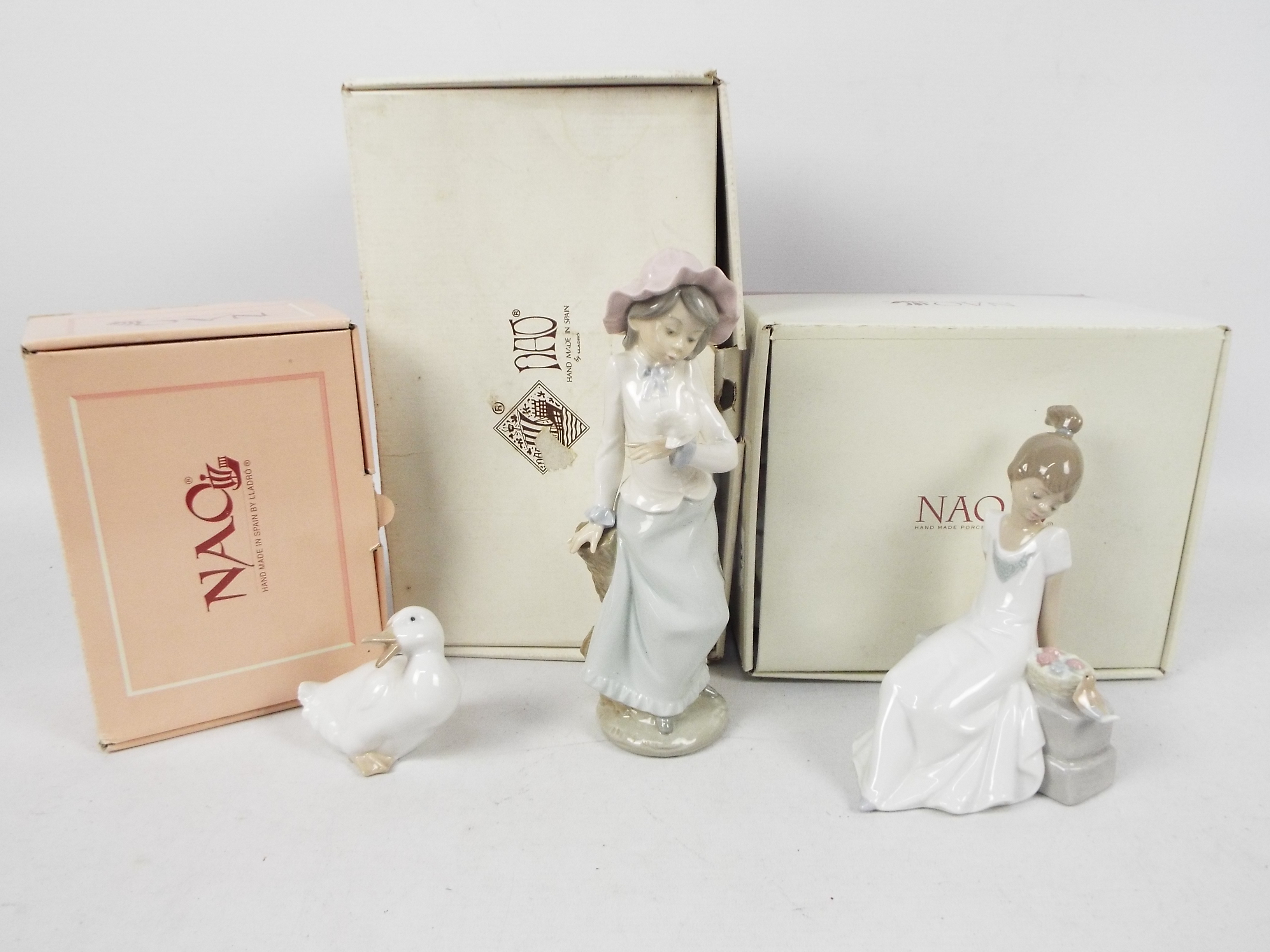 Three Nao figures, two contained in original boxes, the other in associated box,