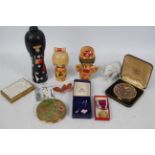 A mixed lot to include powder compacts, stick pins, small Lladro elephant (8 cm height), Swarovski,