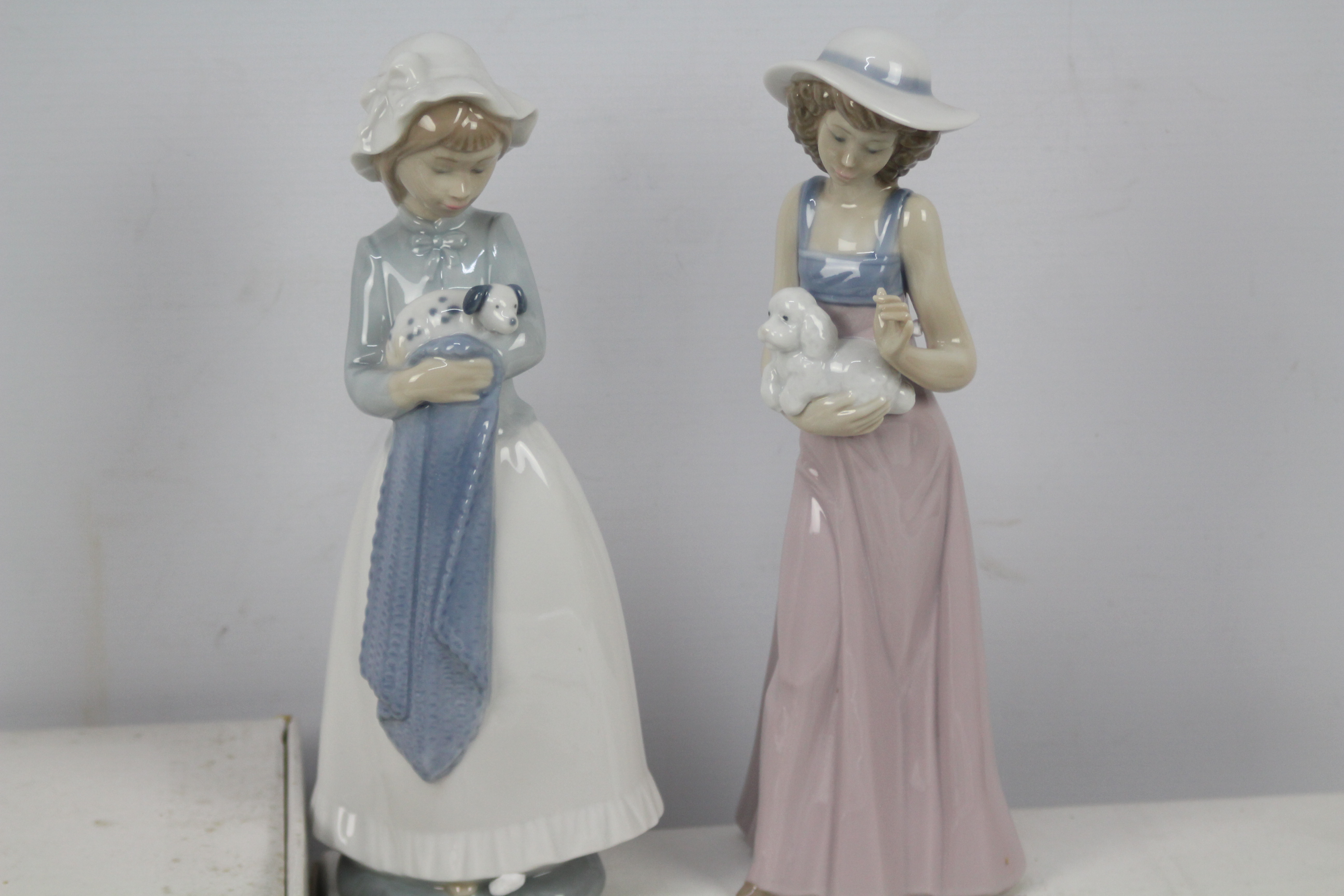 Two boxed Nao figures and four Wedgwood / Danbury Mint plates. - Image 2 of 3