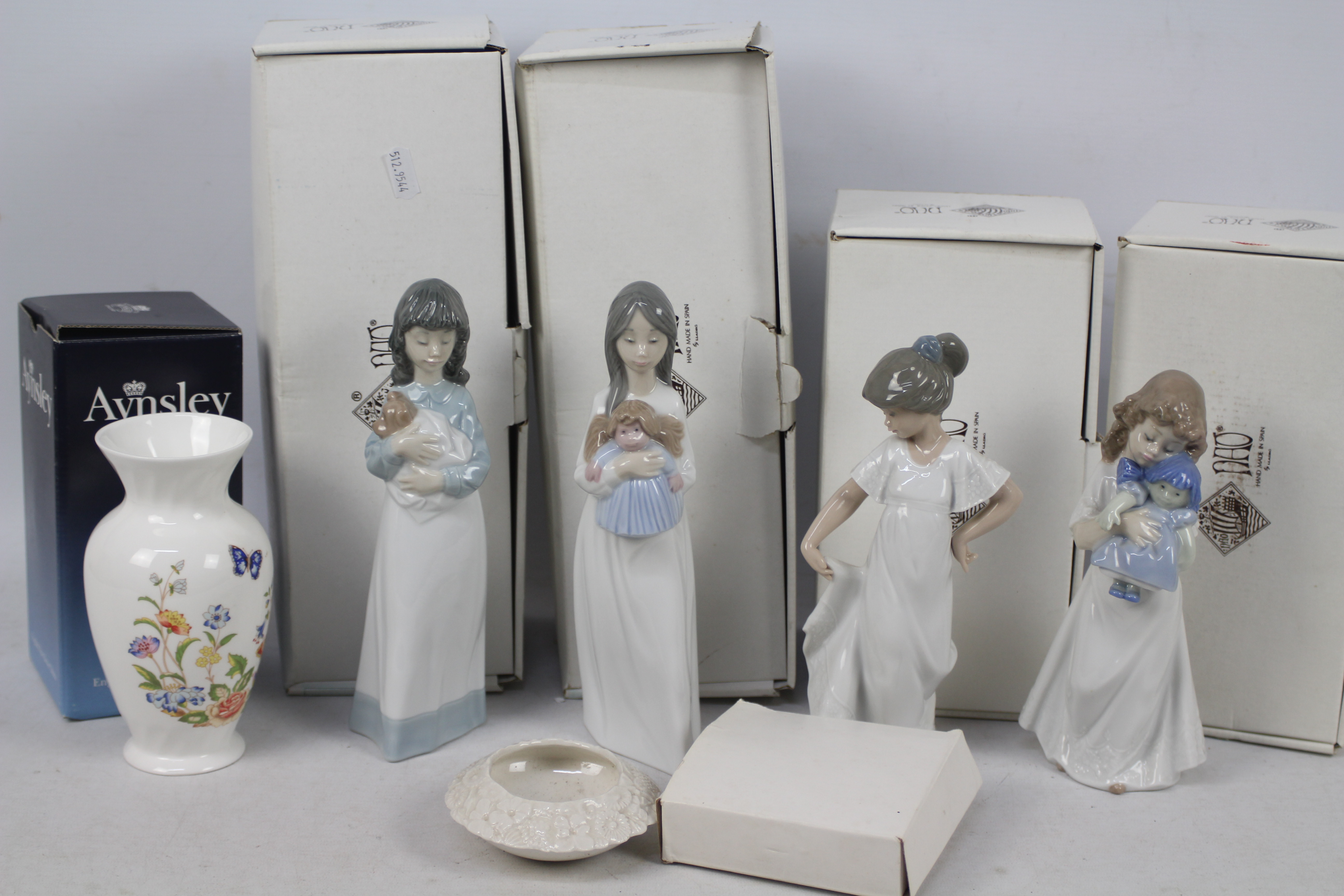 Four boxed Nao figures of children, an Aynsley vase (also boxed) and similar,