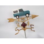 A cast iron, wall mountable, weather vane with Land Rover surmount, approximately 50 cm (h),