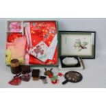 A traditional Japanese clothing set for a child, model of a Kabuto, Buddha pendant and other.