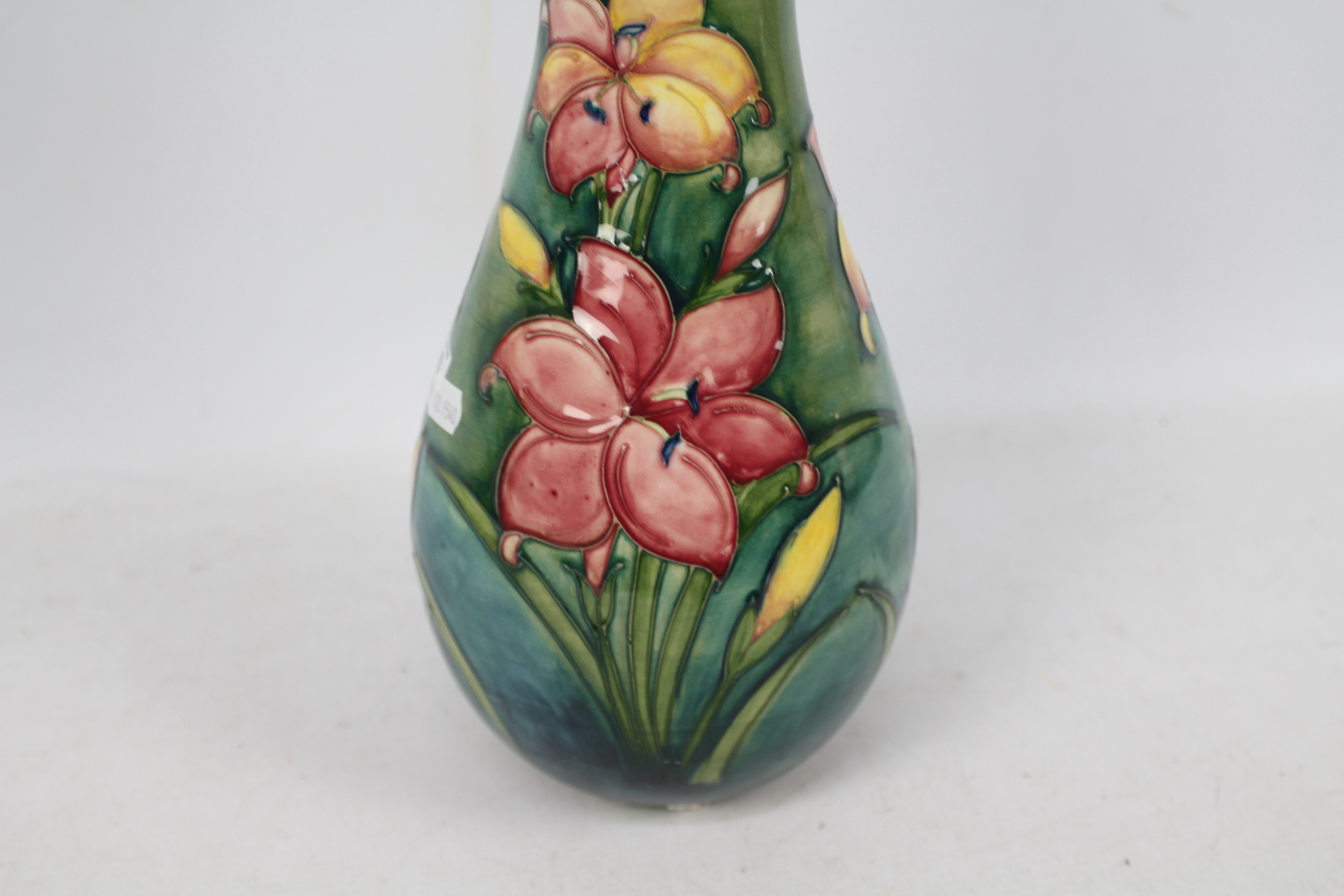 Moorcroft - A Moorcroft pottery baluster vase decorated in the Freesia pattern against a green - Image 2 of 9