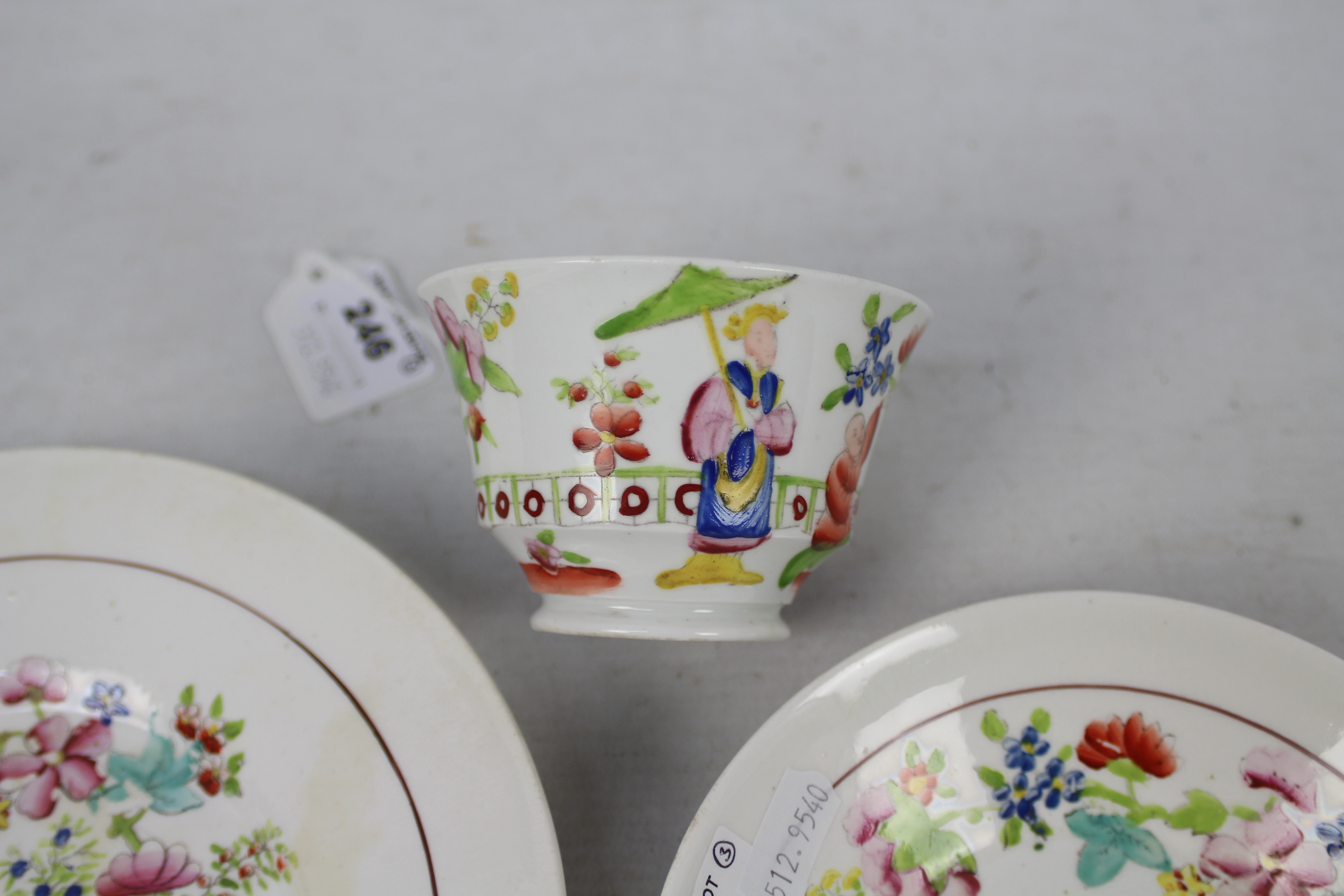 A cup, saucer and plate decorated with figures in a garden setting, unmarked to the base, - Image 4 of 6
