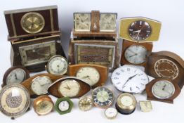 A quantity of clocks to include Metamec, Smiths and other.
