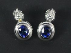 A pair of platinum, sapphire and diamond drop earrings, approximately 10.9 grams.