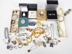 A collection of various costume jewellery with some silver / white metal to include locket, rings,
