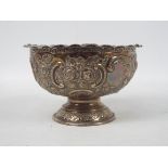 A late Victorian silver rose bowl decorated with repousse floral scrolls, London assay 1900,