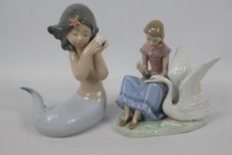 Nao - Two figures / groups comprising a mermaid holding a shell to her ear and a girl with swan,