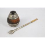 An Argentinian white and yellow metal mounted yerba mate and bombilla, stamped 800,