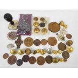 Lot to include buttons, cap badges, German Third Reich style desk stamp, medallions,