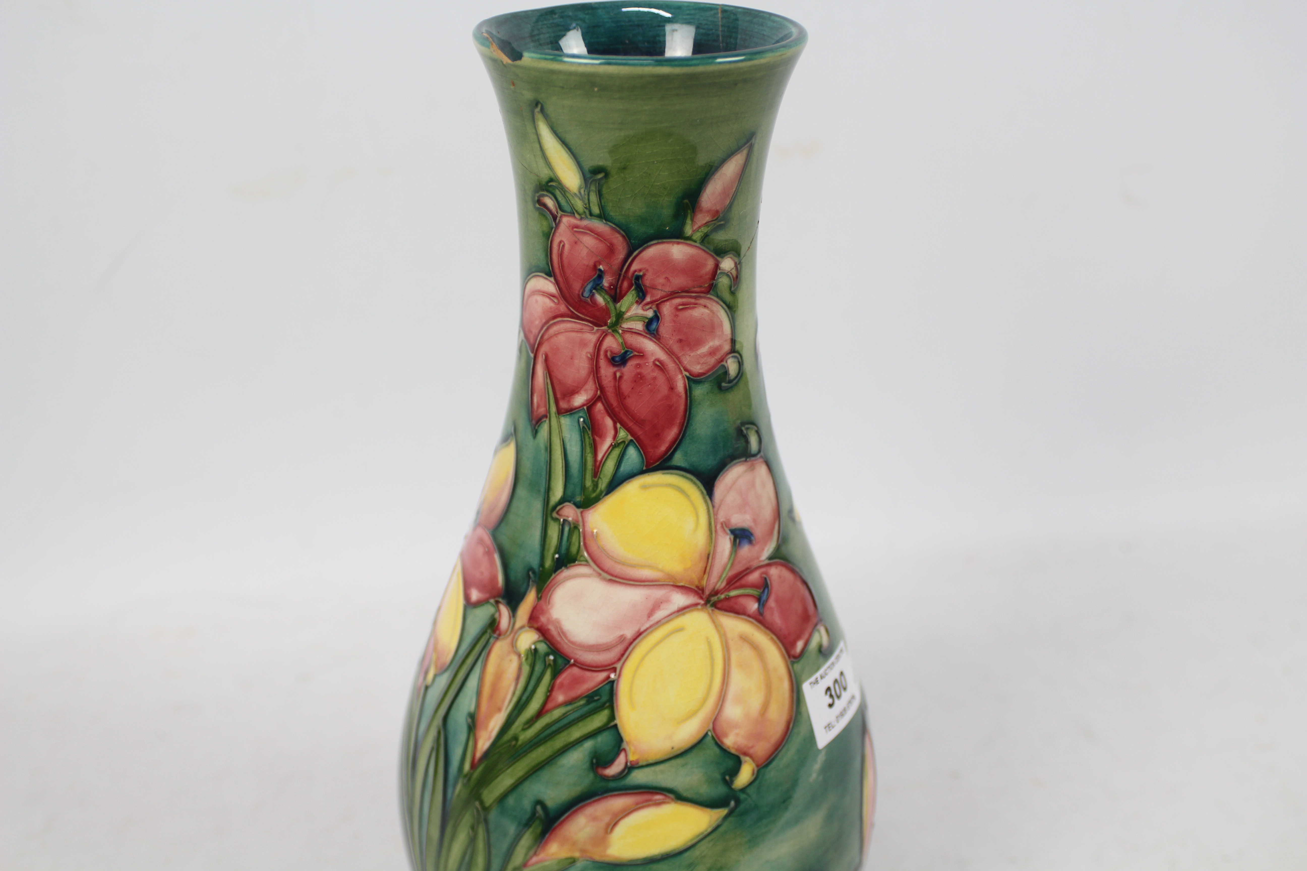 Moorcroft - A Moorcroft pottery baluster vase decorated in the Freesia pattern against a green - Image 3 of 9