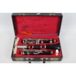 A cased Boosey & Hawkes Regent clarinet, numbered 491572.