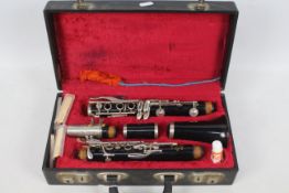 A cased Boosey & Hawkes Regent clarinet, numbered 491572.