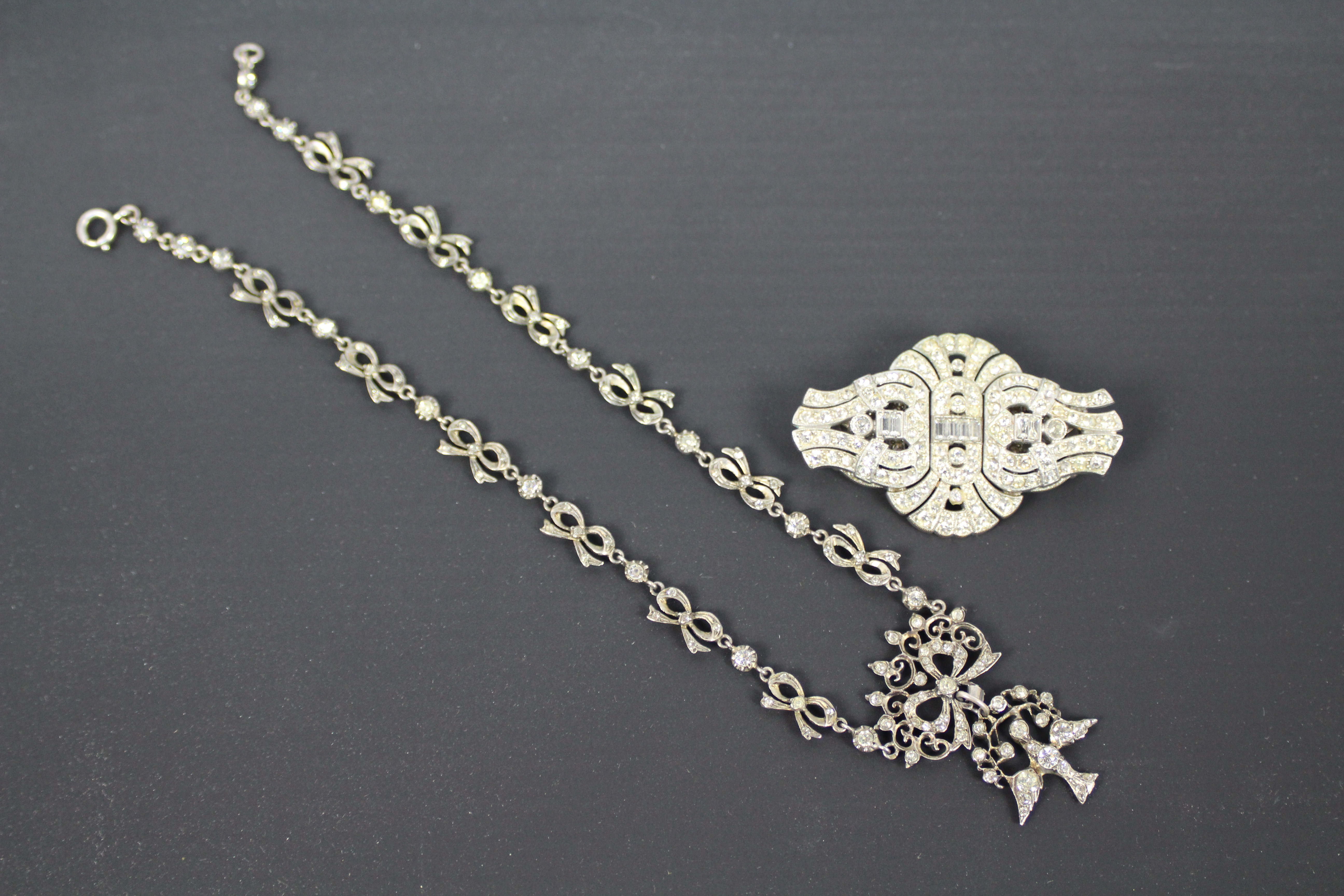 A paste set brooch and necklace (39 cm length).