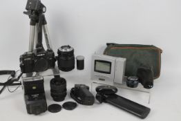 Photography - A Minolta X-700 camera, lenses and further accessories.