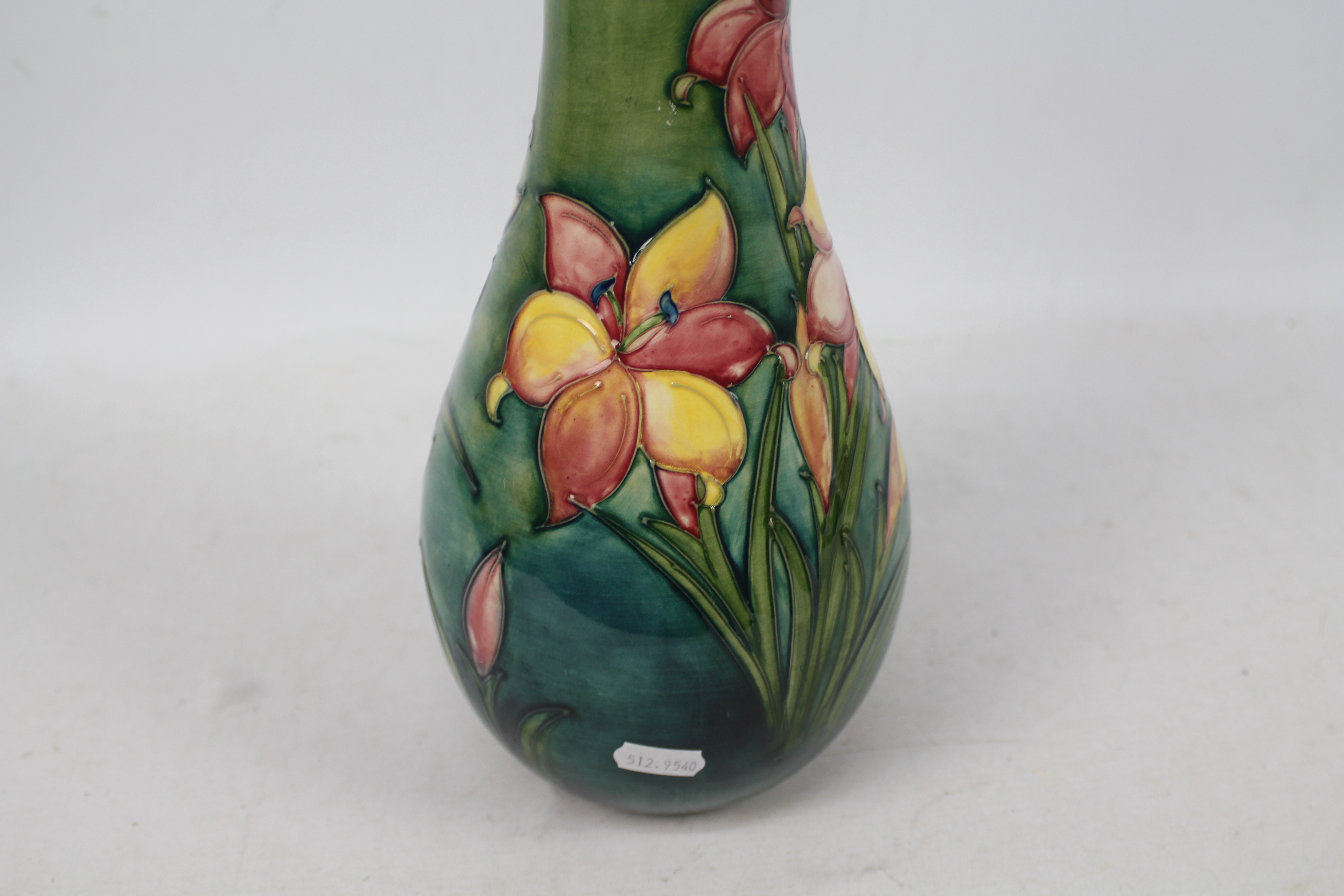 Moorcroft - A Moorcroft pottery baluster vase decorated in the Freesia pattern against a green - Image 4 of 9