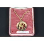 A 9ct yellow gold necklace and Zodiac pendant for Aries, chain 60 cm (l), approximately 11.7 grams.