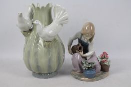 A Lladro figure, # 1376 depicting a girl watering flowers and a further piece of Spanish porcelain,