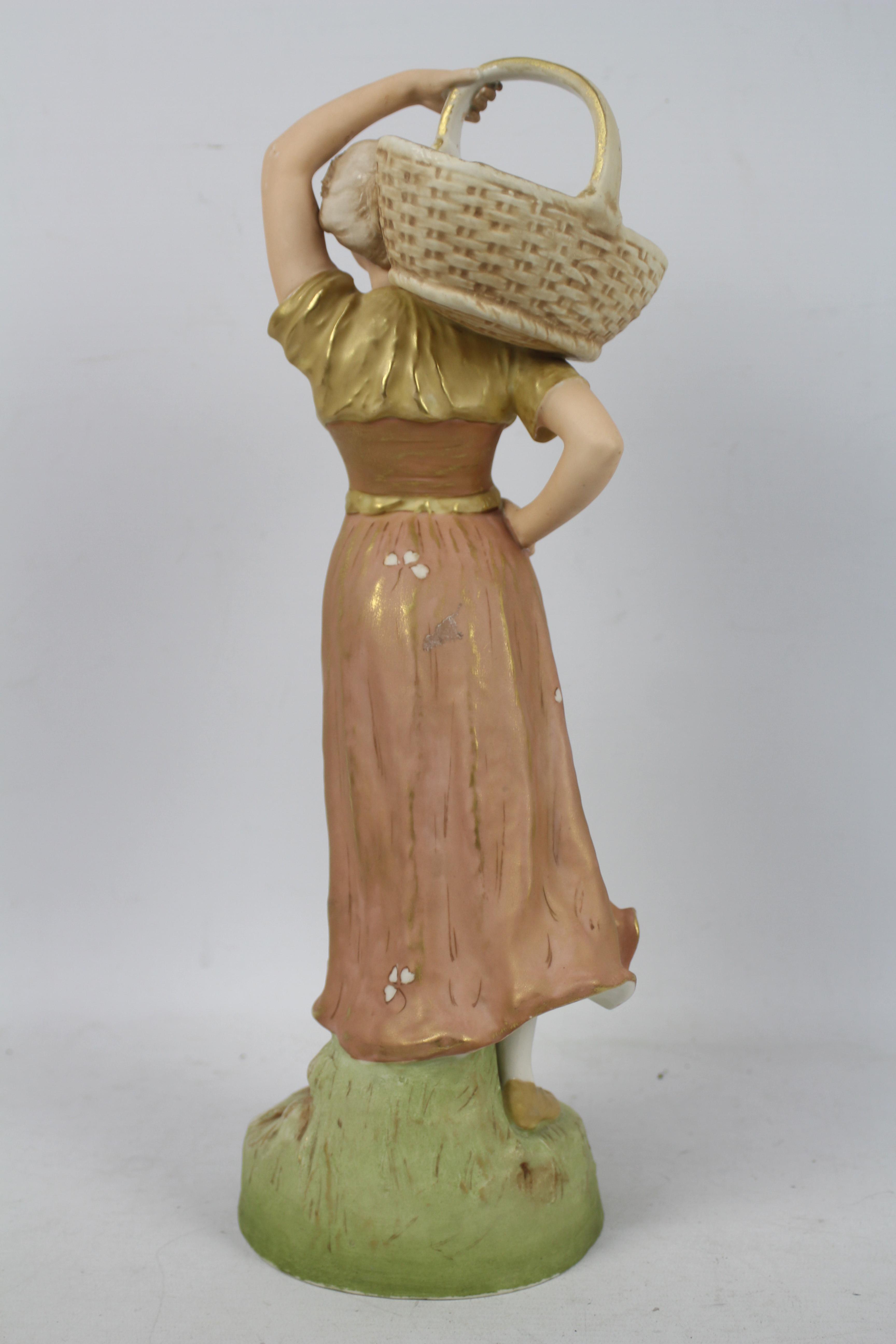 Royal Dux - A figure depicting a female carrying a basket on her shoulder, - Image 5 of 9