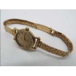 Omega - a lady's 9 ct gold wristwatch, dial 15 mm diameter, quartz movement,