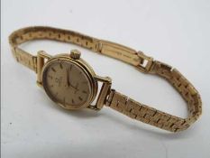Omega - a lady's 9 ct gold wristwatch, dial 15 mm diameter, quartz movement,