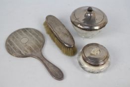 A collection of silver mounted dressing table items,