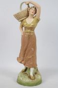 Royal Dux - A figure depicting a female carrying a basket on her shoulder,