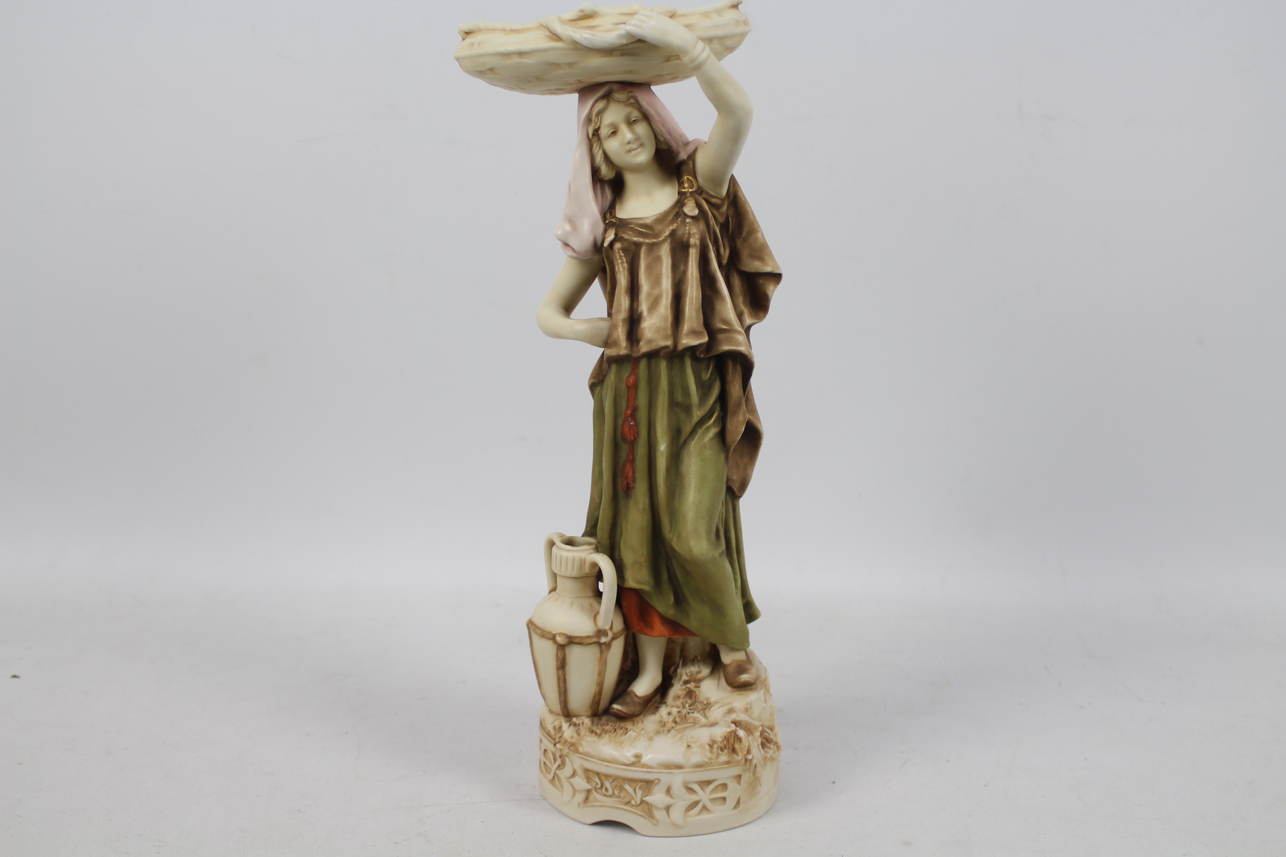 Royal Dux - A figure depicting an Eastern style female water carrier,