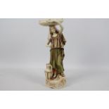 Royal Dux - A figure depicting an Eastern style female water carrier,