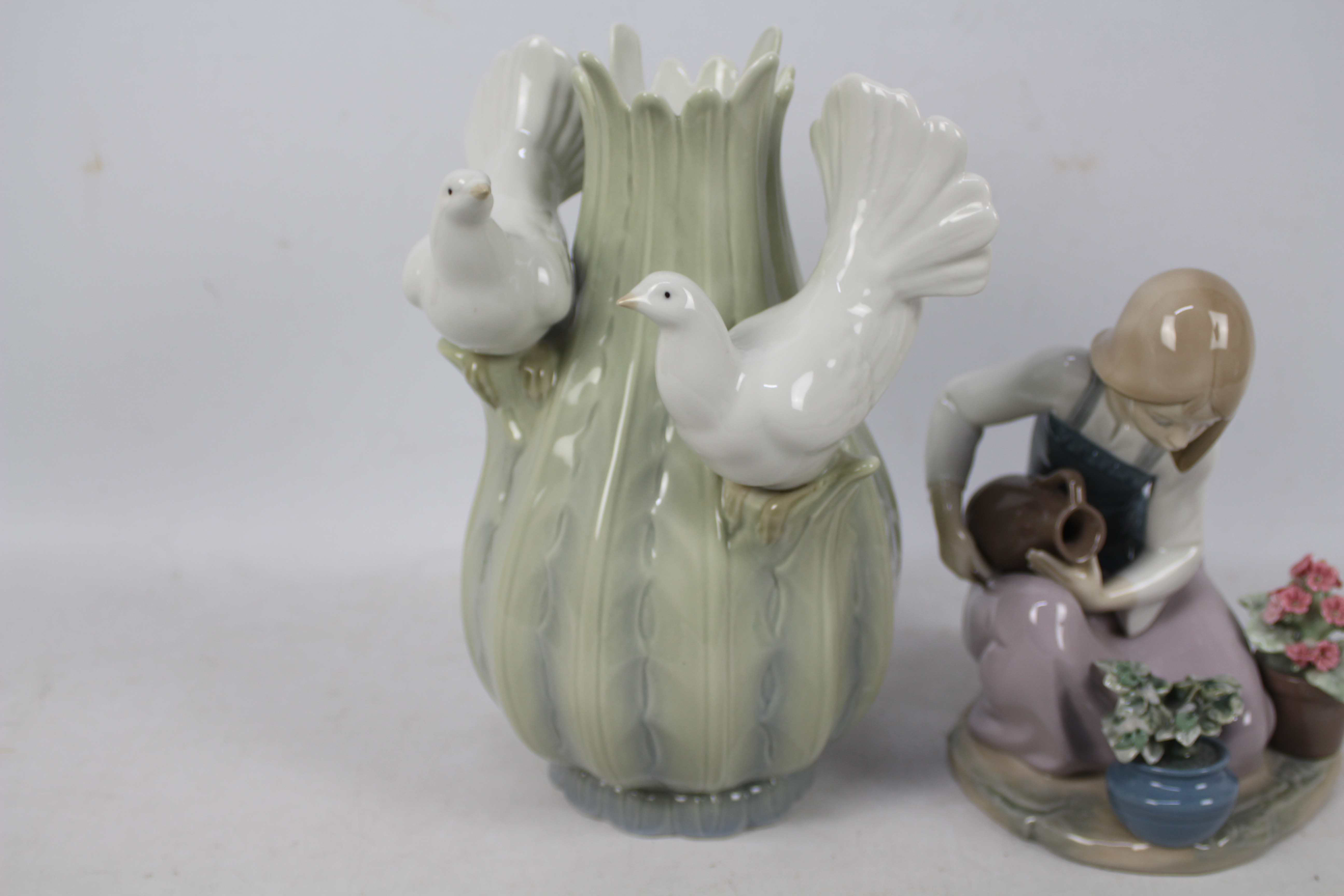 A Lladro figure, # 1376 depicting a girl watering flowers and a further piece of Spanish porcelain, - Image 2 of 5