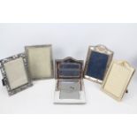Six easel back photograph frames three of which are silver mounted,