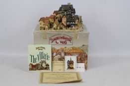 A large, vintage David Winter sculpture The Village, contained in original box with paperwork.