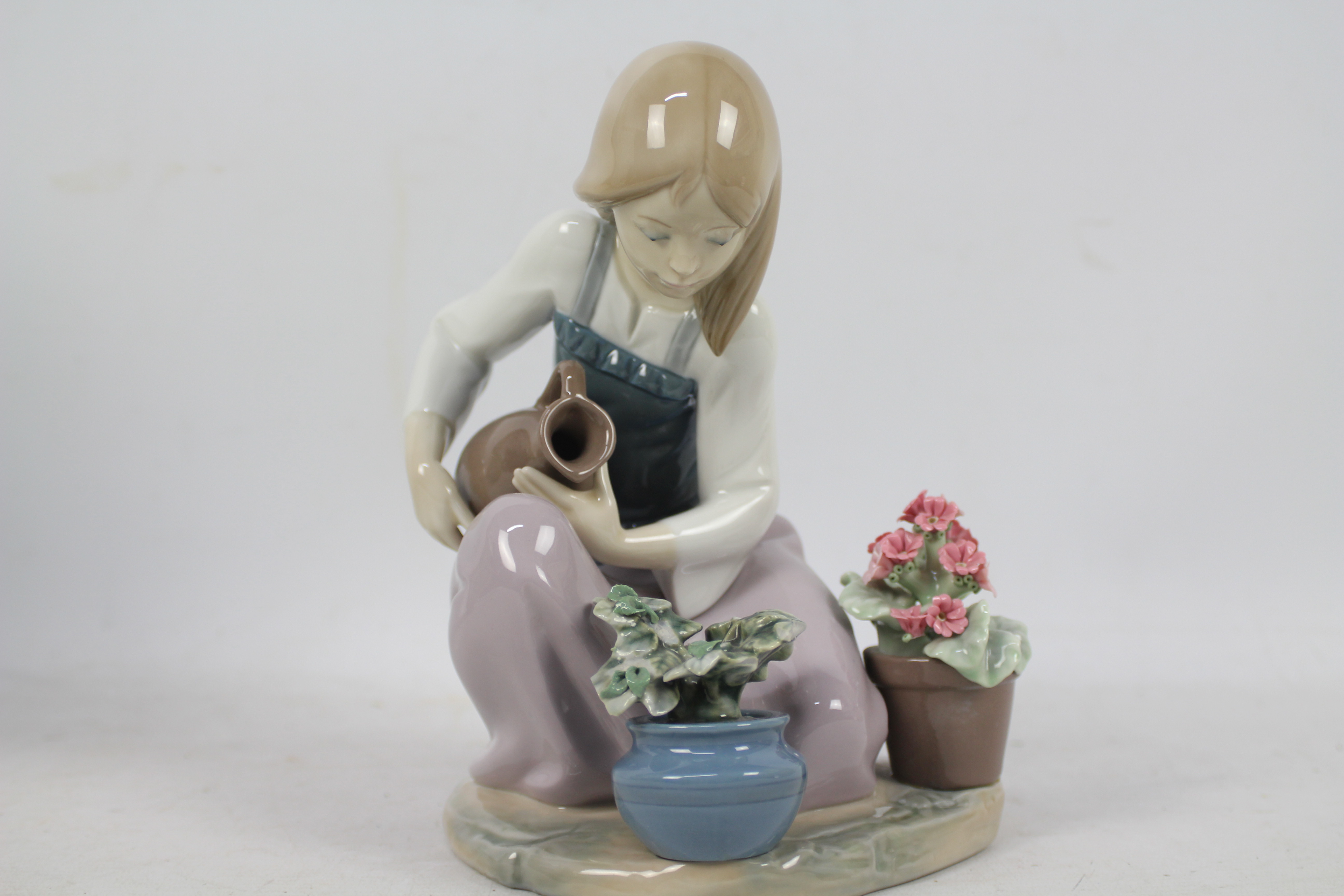 A Lladro figure, # 1376 depicting a girl watering flowers and a further piece of Spanish porcelain, - Image 4 of 5