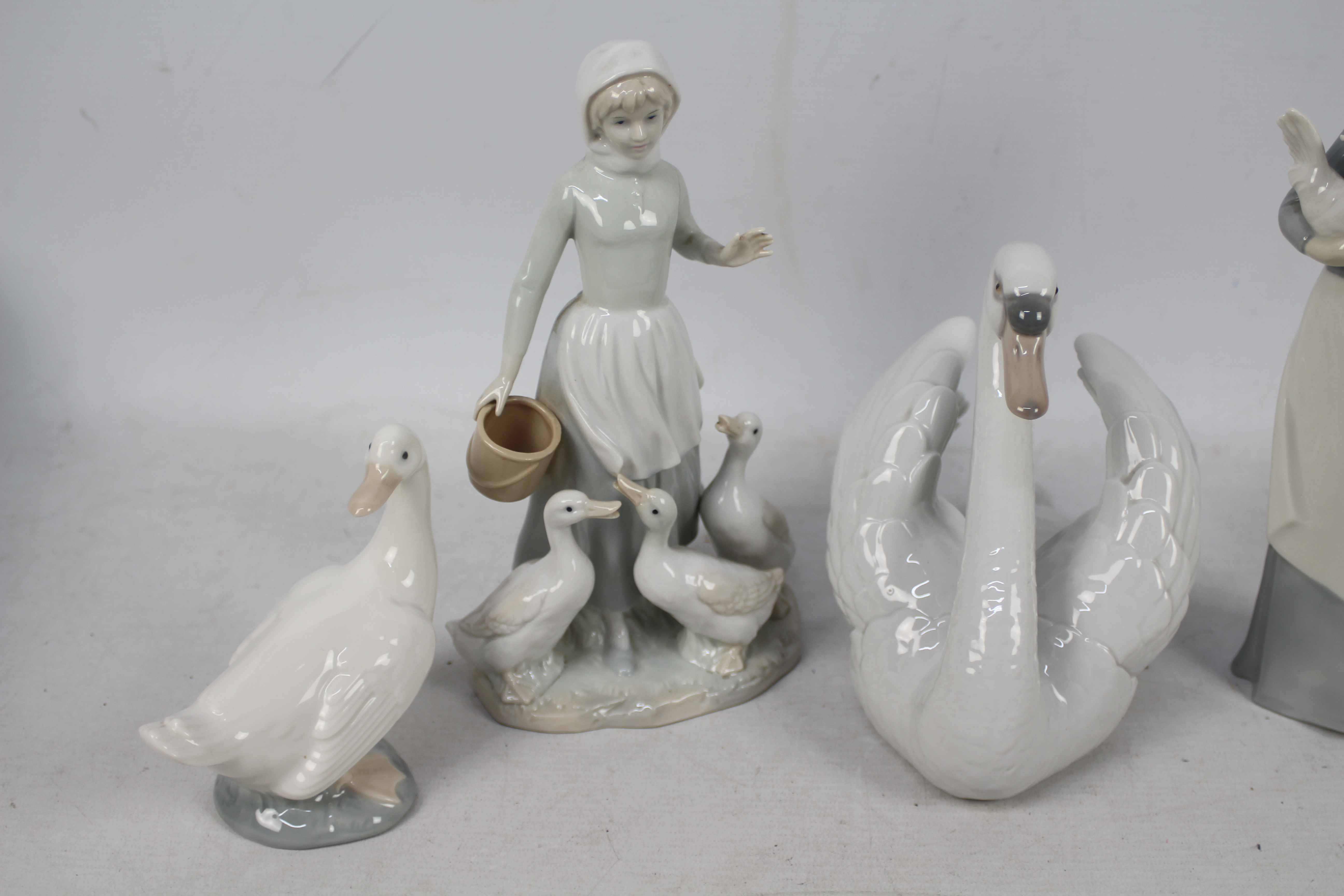Lladro, Nao and similar figures / groups, largest approximately 27 cm (h). - Image 2 of 5