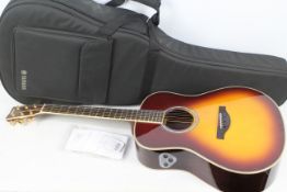 Trans Acoustic Guitar - Yamaha. A Yamaha LL-TA, TransAcoustic Electro Guitar - Natural Finish.