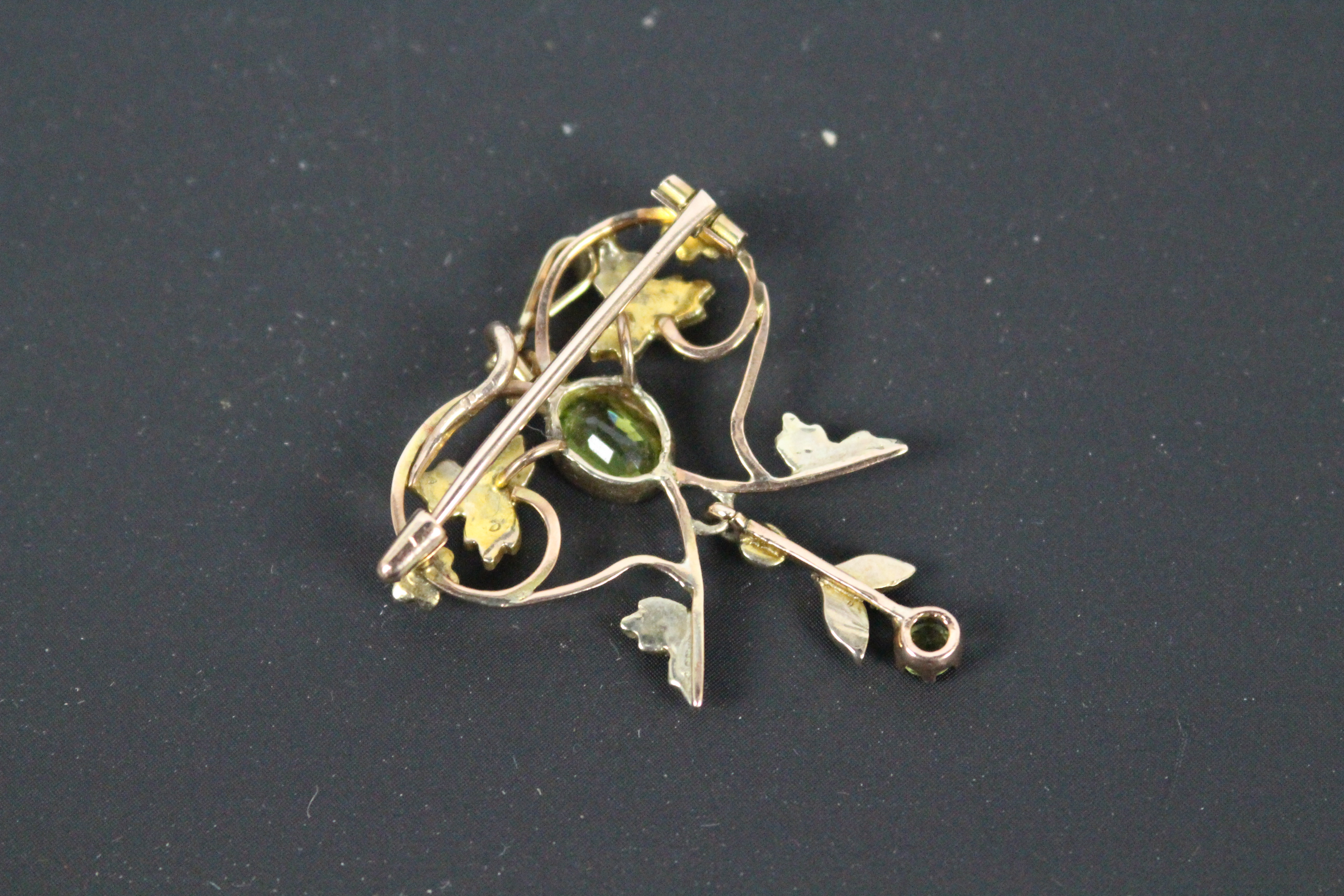 A yellow metal, peridot and seed pearl pendant / brooch, unmarked (presumed 9ct), approximately 3. - Image 2 of 2
