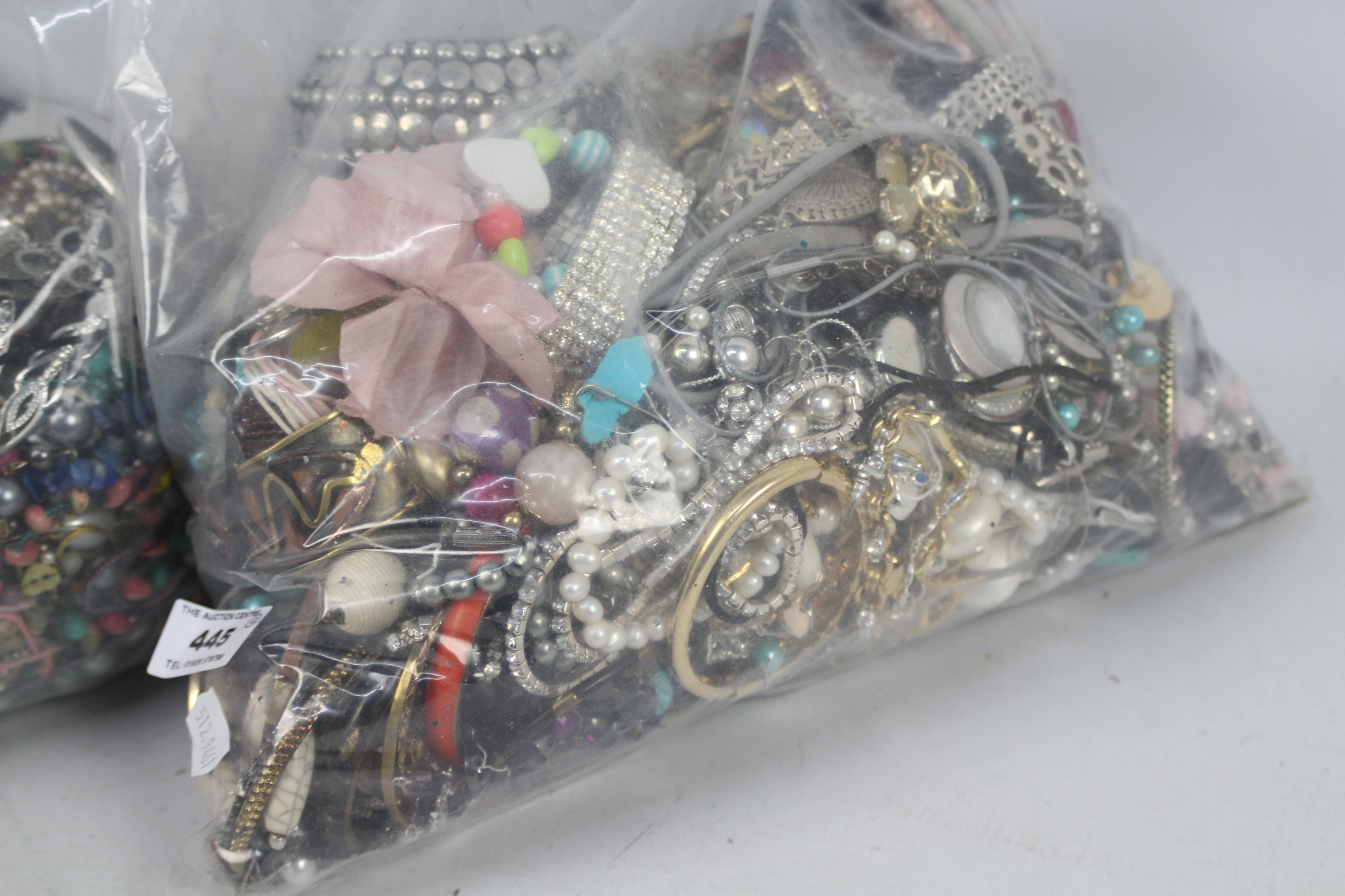 Two clear bags of unsorted costume jewellery, in excess of 10 kg. - Image 3 of 3