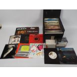 A quantity of 7" vinyl records to include Kraftwerk, The Jam, Queen, Culture Club,