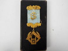 A cased, early 20th century Australian 9ct gold Masonic jewel,