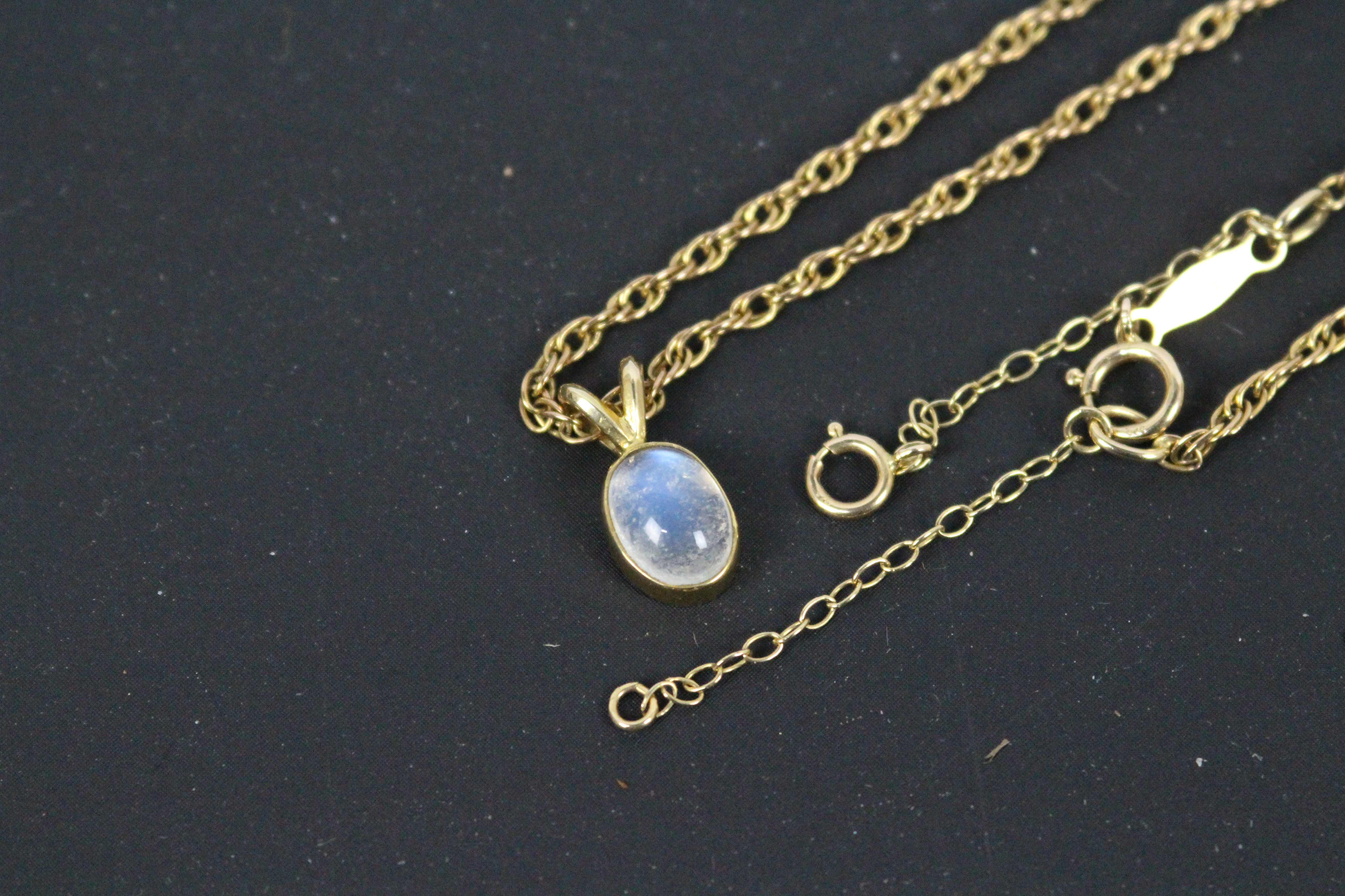 A 9ct yellow gold and cabochon moonstone pendant on 9ct gold Prince Of Wales chain (54 cm length), - Image 3 of 4