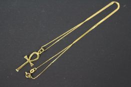 A yellow metal Ankh cross pendant,
