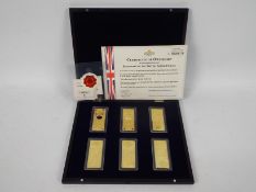 A limited edition, Windsor Mint, 24ct gold plated Banknotes Of The British Armed Forces set,