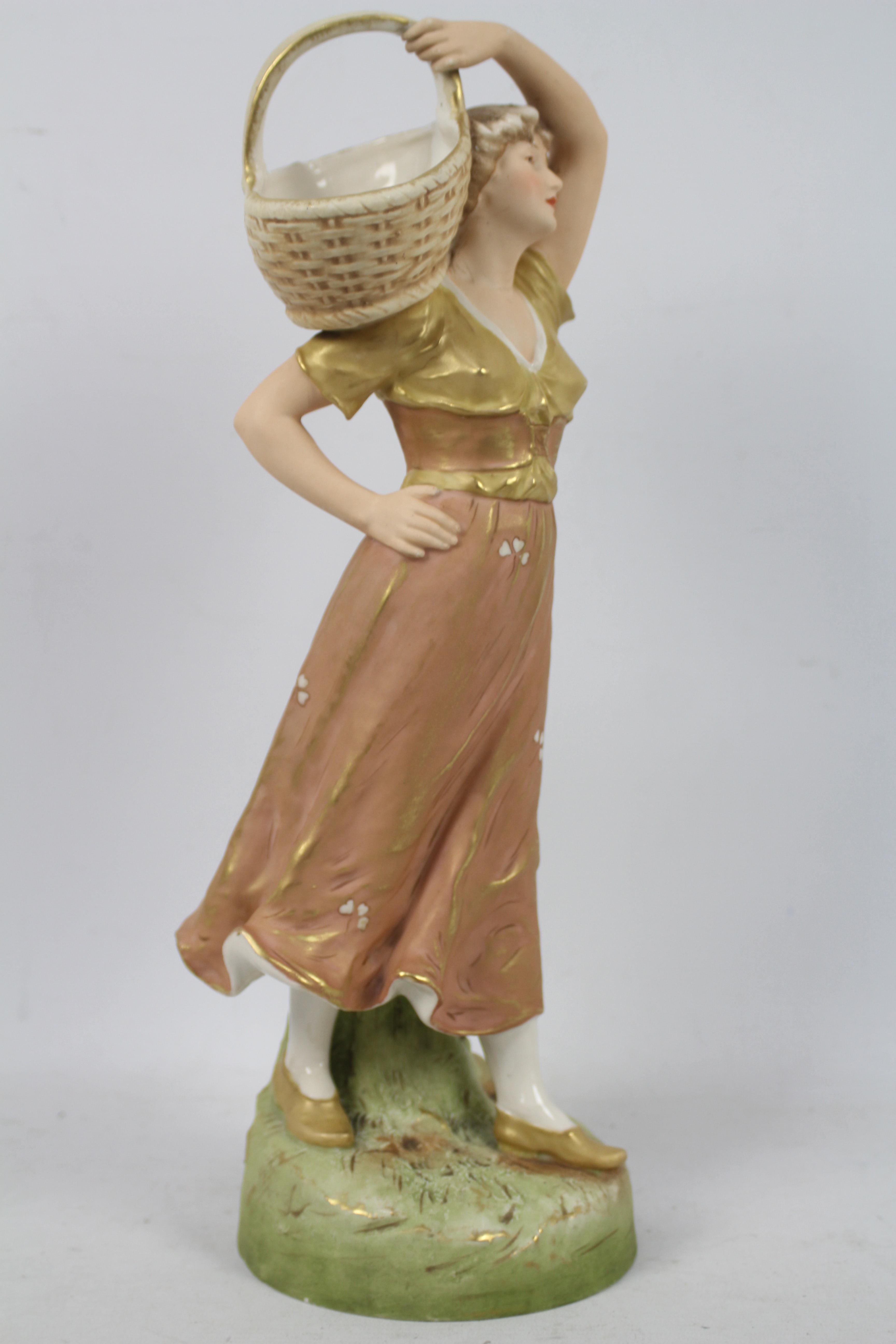 Royal Dux - A figure depicting a female carrying a basket on her shoulder, - Image 4 of 9