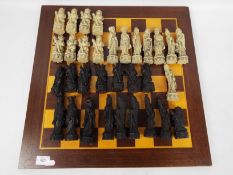 A chess set with Chinese style pieces, king approximately 12.5 cm (h), board 50cm².