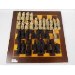 A chess set with Chinese style pieces, king approximately 12.5 cm (h), board 50cm².