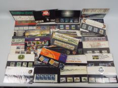 Philately - A collection of Royal Mail mint stamp presentation packs, in excess of £80 face value.