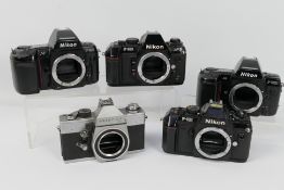 Photography - Four Nikon camera bodies comprising an F801, F501, F801S and F301,