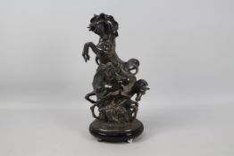 Ottaviani (Italian), 20th century - A silvered sculpture of three horses surmounting a rock,